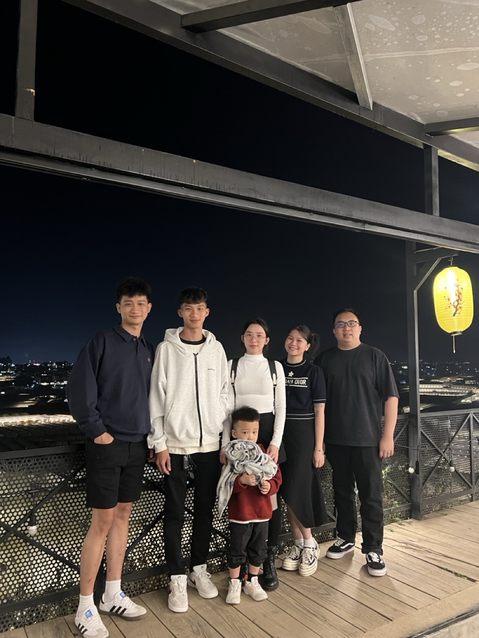 Everyone at the balcony of a restaurant
